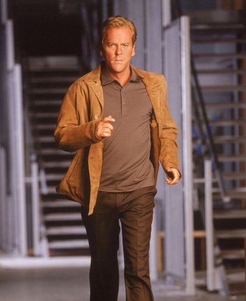 This precedent-setting television series takes place over a 24 hour day, from midnight to midnight, with each episode covering one hour in the life of the characters told in real time.  Jack Bauer (Kiefer Sutherland, pictured) is the head of an elite team of CIA agents with only 24 hours to uncover an assasination plot against the Presidental candidate David Palmer (Dennis Haysbert.)  ª©2001FOX BROADCASTING CR:FOX