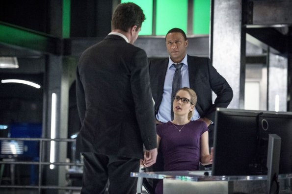 Arrow -- "Bratva" -- Image AR512a_0212b.jpg -- Pictured (L-R): Stephen Amell as Oliver Queen, David Ramsey as John Diggle, and Emily Bett Rickards as Felicity Smoak -- Photo: Cate Cameron/The CW -- ÃÂ© 2017 The CW Network, LLC. All Rights Reserved.