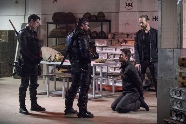 Arrow -- "Promises Kept" -- Image AR606a_0058b.jpg -- Pictured (L-R): Liam Hall as Kane Wolfman, Manu Bennett as Slade Wilson/Deathstroke, Stephen Amell as Oliver Queen, and Kris Holden-Reid as Nylander -- Photo: Jack Rowand/The CW -- ÃÂ© 2017 The CW Network, LLC. All Rights Reserved.