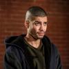 Arrow -- "Divided" -- Image Number: AR610b_0189.jpg -- Pictured: Rick Gonzalez as Rene Ramirez/Wild Dog -- Photo: Daniel Power/The CW -- ÃÂ© 2018 The CW Network, LLC. All Rights Reserved.