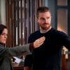 Arrow -- "Emerald Archer" -- Image Number: AR712A_0076b -- Pictured (L-R): Jessica Heafey as Documentarian and Stephen Amell as Oliver Queen/Green Arrow -- Photo: Shane Harvey/The CW -- ÃÂ© 2019 The CW Network, LLC. All Rights Reserved.