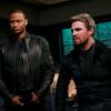 Arrow -- "Welcome to Hong Kong" -- Image Number: AR802a_0422b.jpg -- Pictured (L-R): David Ramsey as John Diggle/Spartan and Stephen Amell as Oliver Queen/Green Arrow -- Photo: Sergei Bachlakov/The CW -- © 2019 The CW Network, LLC. All Rights Reserved.