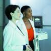Black Lightning -- "The Book of Secrets: Chapter One: Prodigal Son" -- Image BLK211b_0027b.jpg -- Pictured (L-R): Jennifer Riker as Dr. Helga Jace and Christine Adams as Lynn -- Photo: Jace Downs/The CW -- ÃÂ© 2019 The CW Network, LLC. All rights reserved