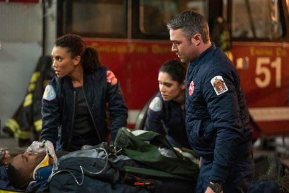 CHICAGO FIRE -- "Until The Weather Breaks" Episode 719 -- Pictured: (l-r) Annie Ilonzeh as Emily Foster, Miranda Rae Mayo as Stella Kidd, Taylor Kinney as Kelly Severide -- (Photo by: Elizabeth Morris/NBC)