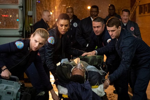 CHICAGO FIRE -- "Until The Weather Breaks" Episode 719 -- Pictured: (l-r) Kara Killmer as Sylvie Brett, Annie Ilonzeh as Emily Foster, Taylor Kinney as Kelly Severide, Jesse Spencer as Matthew Casey -- (Photo by: Elizabeth Morris/NBC)