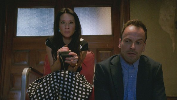 "The Games Underfoot" -- When an archeologist is murdered, Holmes and Watson believe the man may have been killed for what he discovered during his last excavation in a local landfill. Also, Sherlock\'s relationship with Alfredo, his friend and former sobriety sponsor, hits a rough patch, on ELEMENTARY, Thursday, Dec. 10 (10:00-11:00 PM, ET/PT) on the CBS Television Network.  Pictured Lucy Liu  as Joan Watson and Jonny Lee Miller as Sherlock Holmes   Best Possible Screen Grab/ CBS ÃÂ©2015 CBS Broadcasting Inc. All Rights Reserved.