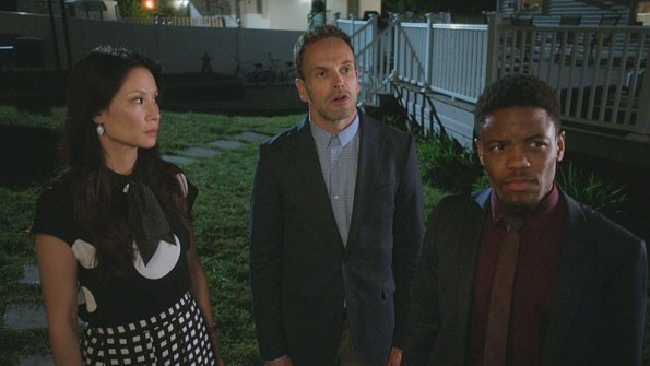 "The Games Underfoot" -- When an archeologist is murdered, Holmes and Watson believe the man may have been killed for what he discovered during his last excavation in a local landfill. Also, Sherlock\'s relationship with Alfredo, his friend and former sobriety sponsor, hits a rough patch, on ELEMENTARY, Thursday, Dec. 10 (10:00-11:00 PM, ET/PT) on the CBS Television Network.  Pictured (L-R)  Lucy Liu  as Joan Watson , Jonny Lee Miller as Sherlock Holmes and Jon Michael Hill  as Detective Marcus Bell     Best Possible Screen Grab/ CBS ÃÂ©2015 CBS Broadcasting Inc. All Rights Reserved.
