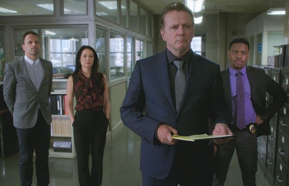 "The Games Underfoot" -- When an archeologist is murdered, Holmes and Watson believe the man may have been killed for what he discovered during his last excavation in a local landfill. Also, Sherlock\'s relationship with Alfredo, his friend and former sobriety sponsor, hits a rough patch, on ELEMENTARY, Thursday, Dec. 10 (10:00-11:00 PM, ET/PT) on the CBS Television Network.  Pictured (L-R)   Jonny Lee Miller as Sherlock Holmes ,Lucy Liu  as Joan Watson, Aidan Quinn as Captain Tommy Gregson and Jon Michael Hill  as Detective Marcus Bell     Best Possible Screen Grab/ CBS ÃÂ©2015 CBS Broadcasting Inc. All Rights Reserved.