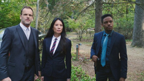 "Sand Trap" -- Holmes and Watson\'s search for the killer of a woman found encased in cement takes them inside the clean technology industry. Also, Watson takes a giant leap forward regarding her interest in adoption, on ELEMENTARY, Monday, June 18 (10:00-11:00, ET/PT), on the CBS Television Network. Pictured (L-R) Jonny Lee Miller as Sherlock Holmes, Lucy Liu as Joan Watson and Jon Michael Hill as Detective Marcus Bell Photo: Best Possible Screen Grab/CBS ÃÂ©2018 CBS Broadcasting, Inc. All Rights Reserved