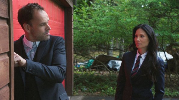 "Sand Trap" -- Holmes and Watson\'s search for the killer of a woman found encased in cement takes them inside the clean technology industry. Also, Watson takes a giant leap forward regarding her interest in adoption, on ELEMENTARY, Monday, June 18 (10:00-11:00, ET/PT), on the CBS Television Network. Pictured (L-R) Jonny Lee Miller as Sherlock Holmes and  Lucy Liu as Joan Watson  Photo: Best Possible Screen Grab/CBS ÃÂ©2018 CBS Broadcasting, Inc. All Rights Reserved