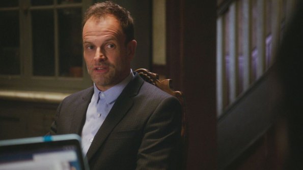"Sand Trap" -- Holmes and Watson\'s search for the killer of a woman found encased in cement takes them inside the clean technology industry. Also, Watson takes a giant leap forward regarding her interest in adoption, on ELEMENTARY, Monday, June 18 (10:00-11:00, ET/PT), on the CBS Television Network. Pictured  Jonny Lee Miller as Sherlock Holmes Photo: Best Possible Screen Grab/CBS ÃÂ©2018 CBS Broadcasting, Inc. All Rights Reserved