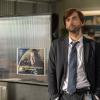 GRACEPOINT: Detective Emmett Carver (David Tennant) observes as Detective Ellie Miller gives a briefing in "Episode Three" of GRACEPOINT airing Thursday, Oct. 9 (9:00-10:00 PM ET/PT) on FOX. ©2014 Fox Broadcasting Co. Cr: Ed Araquel/FOX