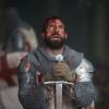 tom_cullen_as_landry_bowed_before_his_sword_in_historys_new_drama_series_knightfall