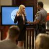 "Civil Wars (Part 1)"--Jamie and Roy are back on opposite sides in the biggest courtroom battle of their lives when Lee Anne\'s sexual harassment case against the Charleston Police Department finally goes to trial, on the penultimate episode of RECKLESS, Saturday, September 13 (8:00-9:00 PM, ET/PT), on the CBS Television Network. Pictured L-R: Georgina Haig as Lee Anne Marcus and L. Warren Young as the bailiff Photo: Jackson Lee Davis/ CBS ÃÂ©2013 CBS Broadcasting, Inc. All Rights Reserved