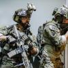 "Say Again Your Last" -- While tasked with rescuing a group of American students held hostage in Mumbai, Bravo Team suffers life-threatening injuries, on SEAL TEAM, Wednesday, Oct. 31 (9:00-10:00 PM, ET/PT) on the CBS Television Network. Pictured L to R: Neil Brown Jr. as Ray Perry and Max Thieriot as Clay Spenser. Photo: Erik Voake/CBS ÃÂ©2018 CBS Broadcasting, Inc. All Rights Reserved