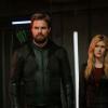 Supergirl -- "Crisis on Infinite Earths: Part One" -- Image Number: SPG509b_0207r.jpg -- Pictured (L-R): Stephen Amell as Oliver Queen/Green Arrow and Katherine McNamara as Mia -- Photo: Katie Yu/The CW -- © 2019 The CW Network, LLC. All Rights Reserved.