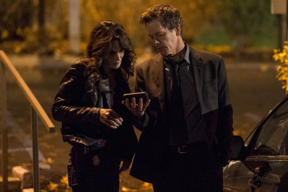 THE FOLLOWING: Ryan Hardy (Kevin Bacon, R) and FBI Specialist Parker (Annie Parisse, L) gather information in the &quot;Welcome Home&quot; episode of THE FOLLOWING airing Monday, March 11 (9:00-10:00 PM ET/PT) on FOX. &#xa9;2013  Fox Broadcasting Co. CR: David Giesbrecht/FOX