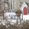 Rev Matt puts letters up on the church marquee
