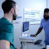 THE RESIDENT:  L-R: Guest star Tasso Feldman and Malcolm-Jamal Warner in the "Woman Down" episode of THE RESIDENT airing Tuesday, Nov. 19 (8:00-9:00 PM ET/PT) on FOX. ©2019 Fox Media LLC Cr: Guy D'Alema/FOX