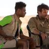 "Fight Or Flight" -- After Jackson Oz rescues his best friend, Abraham Kenyatta, from a lion attack in Botswana, Abraham\'s firsthand account of the attack reveals that the lions are no longer afraid of humans and might be killing for sport. Also, Jamie and Mitch run tests on a lion cub in the Los Angeles Zoo and uncover a link to a chemical made by a biotechnology company, and Chloe Tousignant returns to Paris where she must overcome her own trauma and focus on her work as a government intelligence analyst, on ZOO, Tuesday, July 7 (9:00-10:00 PM, ET/PT) on the CBS Television Network. Pictured (L-R) Isaac White as Daniel and James Wolk as Jackson Oz   Photo:  Hilary Bronwyn Gayle/CBS  ÃÂ© 2015 CBS Broadcasting Inc. All Rights Reserved.