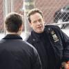 "Authority Figures" -- When a video surfaces of officers partaking in a clear case of entrapment, Frank focuses on finding the cop who leaked the video. Also, Eddie retaliates against a co-worker who is pranking Jamie; Danny and Baez investigate the murder of a tabloid writer who worked in the hip-hop scene; and Erin gives a high-profile case to a young ADA under her tutelage, on BLUE BLOODS, Friday, Dec. 7 (10:00-11:00 PM, ET/PT) on the CBS Television Network. Pictured:   Will Estes, John Asher.  Photo: John Paul Filo/CBS  ÃÂ©2018CBS Broadcasting Inc. All Rights Reserved.