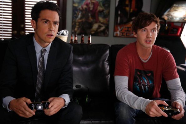 BONES: Special Agent James Aubrey (guest star John Boyd, L) and gaming designer Noah Gummersall (guest star Erik Stocklin, R) test a new game during the investigation into the murder of a video game designer in the "The Geek In The Guck" episode of BONES airing Thursday, Oct. 16 (8:00-9:00 PM ET/PT) on FOX. ©2014 Fox Broadcasting Co. Cr: Jordin Althaus/FOX