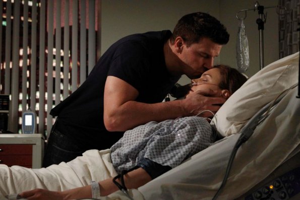BONES:  Booth (David Boreanaz, L) is worried about Brennan's (Emily Deschanel, R) condition after she is shot while working late at the Jeffersonian lab in the &quot;The Shot in the Dark&quot; episode of BONES airing Monday, Feb. 11 (8:00-9:00 PM ET/PT) on FOX.  &#xa9;2013 Fox Broadcasting Co. Cr: Jordin Althaus/FOX