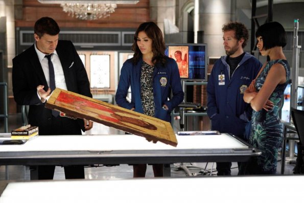 BONES:  L-R:  Booth (David Boreanaz), Angela (Michaela Conlin), Hodgins (TJ Thyne) and Cam (Tamara Taylor) investigate an artifact from the Jeffersonian that may hold a clue to who shot Brennan in the &quot;The Shot in the Dark&quot; episode of BONES airing Monday, Feb. 11 (8:00-9:00 PM ET/PT) on FOX. &#xa9;2013 Fox Broadcasting Co. Cr: Jordin Althaus/FOX