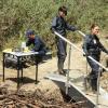 BONES:  Brennan (Emily Deschanel, R) and Cam (Tamara Taylor, C) investigate remains found in a beaver dam in the "The Dude in the Dam" episode of BONES airing Monday, Nov. 11 (8:00-900 PM ET/PT) on FOX.  ©2013 Fox Broadcasting Company.  Cr:  Ray Mickshaw/FOX