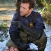 BONES: Hodgins (TJ Thyne) investigates remains found in a swamp in the &quot;The Cold in the Case&quot; episode of BONES airing Friday, April 14 (8:00-9:00 PM ET/PT) on FOX. &#xa9;2014 Fox Broadcasting Co. Cr: Ray Mickshaw/FOX