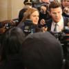 BONES:  Brennan (Emily Deschanel, L) and Booth (David Boreanaz, R) are questioned by the media in the &quot;The Recluse in the Recliner&quot; Season Finale episode of BONES airing Monday, May 19 (8:00-9:00 PM ET/PT) on FOX.  &#xa9;2014 Fox Broadcasting Co.  Cr:  Patrick McElhenney/FOX