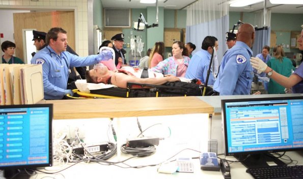 BONES:   Booth (David Boreanaz, C) is rushed to the hospital after receiving multiple gunshot wounds in the "The Recluse in the Recliner" Season Finale episode of BONES airing Monday, May 19 (8:00-9:00 PM ET/PT) on FOX.  ©2014 Fox Broadcasting Co.  Cr:  Adam Taylor/FOX