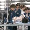 BONES:  When an affluent prep school student is found dead Brennan (Emily Deschanel, R) proves that it was indeed murder, not suicide in the BONES episode "A Boy In A Tree" airing Tuesday, Sept. 20 (8:00-9:00 PM ET/PT) on FOX.   Also pictured L-R:  TJ Thyne, Michaela Conlin, Eric Millegan.  ™©2005 Fox Broadcasting Co.  Cr:  Sam Urdank/FOX.