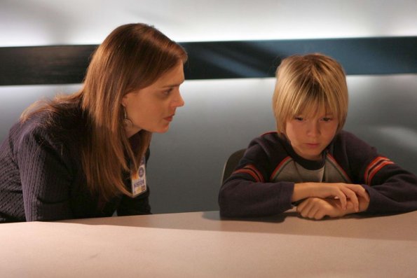 BONES: Brennan (Emily Deschanel, L) connects with a boy (Paul Butcher, R) who might have information about a missing child found dead in the woods in the BONES episode "A Boy in the Bush" airing Tuesday, Nov. 8 (8:00-9:00 PM ET/PT) on FOX. ™©2005 Fox Broadcasting Co. Cr: Carin Baer/FOX. BONES: Brennan (Emily Deschanel, L) connects with a boy (Paul Butcher, R) who might have information about a missing child found dead in the woods in the BONES episode "A Boy in the Bush" airing Tuesday, Nov. 8 (8:00-9:00 PM ET/PT) on FOX. ™©2005 Fox Broadcasting Co. Cr: Carin Baer/FOX.