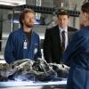 BONES:  Booth (David Boreanaz, R) and Brennan (Emily Deschanel, C) investigate a dead body found in a wall at a club in the BONES episode "The Man in the Wall" airing Tuesday, Nov. 15 (8:00-9:00 PM ET/PT) on FOX.  Also pictured:  TJ Thyne (L).  ™©2005 Fox Broadcasting Co.  Cr:  Isabella Vosmikova/FOX.