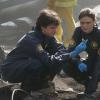 BONES:  Brennan (Emily Deschanel, R) and Zach (Eric Millegan, L) investigate small pieces of bone found at a plane crash site that don't belong to any of the victims in the BONES episode "The Man on the Fairway" airing in its time period premiere Wednesday, March 8 (8:00-9:00 PM ET/PT) on FOX.  ©2006 Fox Broadcasting Co.  Cr:  Carin Baer/FOX