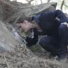 BONES:  Brennan (Emily Deschanel) examines a mysterious spaceship type vessel in the BONES episode "Aliens in the Spaceship" airing Wednesday, Nov. 15 (8:00-9:00 PM ET/PT) on FOX.  ©2006 Fox Broadcasting Co.  Cr:  Carin Baer/FOX