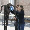 BONES:   Brennan (Emily Deschanel, R) and Booth (David Boreanaz, L) find a gutted and burned body hung up like a scarecrow on the roof of the Federal Building in the BONES episode "Judas on a Pole" airing Wednesday, Dec. 13 (8:00-9:00 PM ET/PT) on FOX.  ©2006 Fox Broadcasting Co.  Cr:  Isabella Vosmikova/FOX