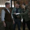 BONES:  Booth (David Boreanaz, C) and Brennan (Emily Deschanel, R) investigate a man (Michael Cudlitz, L) who works at a fetish retreat in the BONES episode "Death in the Saddle" airing Tuesday, Oct. 9 (8:00-9:00 PM ET/PT) on FOX.  