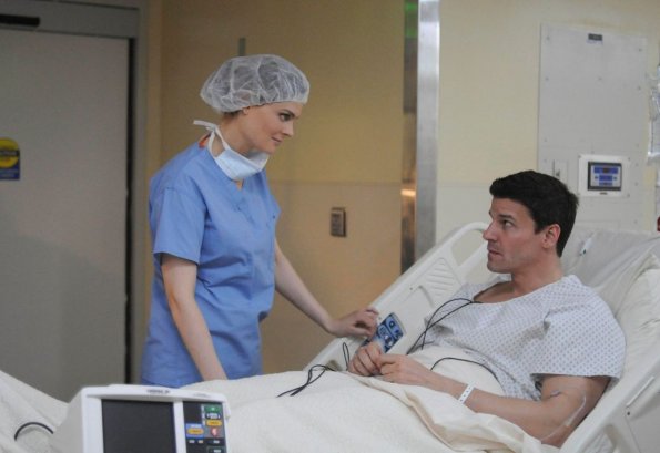 BONES:  Brennan (Emily Deschanel, L) talks to Booth (David Boreanaz, R) prior to his surgery in the BONES episode &quot;The Critic in the Cabernet&quot; airing Thursday, May 7 (8:00-9:00 PM ET/PT) on FOX.  &#xa9;2009 Fox Broadcasting Co.  Cr:  Richard Foreman/FOX