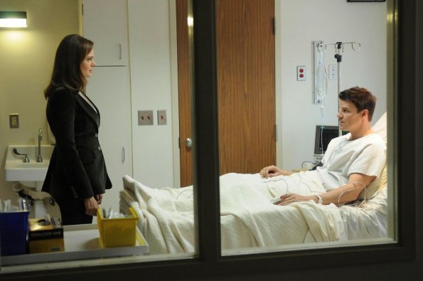 BONES:  Booth (David Boreanaz, R) asks Brennan (Emily Deschanel, L) to be in the operating room with him during surgery in the BONES episode &quot;The Critic in the Cabernet&quot; airing Thursday, May 7 (8:00-9:00 PM ET/PT) on FOX.  &#xa9;2009 Fox Broadcasting Co.  Cr:  Richard Foreman/FOX