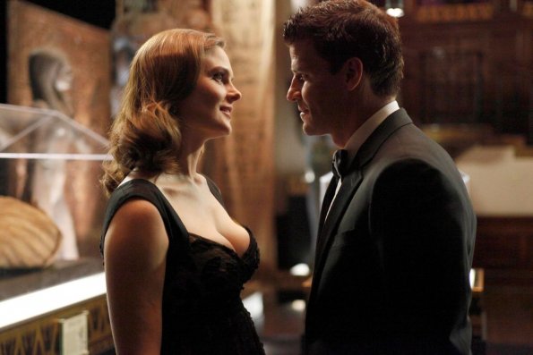 BONES:  Brennan (Emily Deschanel, L) and Booth (David Boreanaz, R) share an intimate moment when they attend a party for the opening of an Egyptology exhibit in the BONES episode &quot;A Night at the Bones Museum&quot; airing Thursday, Oct. 15 (8:00-9:00 PM ET/PT) on FOX.  &#xa9;2009 Fox Broadcasting Co.  Cr:  Greg Gayne/FOX