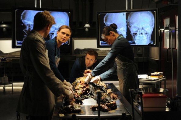 BONES:  Brennan (Emily Deschanel, second from L), Hodgins (TJ Thyne, second from R) and Cam (Tamara Taylor, R) investigate the remains of a chicken farmer whose body is found mutilated on a river bank in the BONES episode &quot;The Tough Man in the Tender Chicken&quot; airing Thursday, Nov. 5 (8:00-9:00 PM ET/PT) on FOX.   &#xa9;2009 Fox Broadcasting Co.  Cr:  Ray Mickshaw/FOX