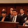 The team worriedly listens to the case unfold.