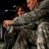 Booth shows Brennan photos of him in Afghanistan.
