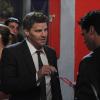 Booth asks the doorman if he's seen their prime suspect.