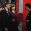 Brennan tries to convince the doorman to let them into the nightclub.