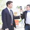 Johnny takes Booth's wallet as a trick.