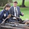 BONES:  Brennan (Emily Deschanel, L) and Booth (David Boreanaz, R) investigate a case where a human carcass has melted into the dashboard of a charred truck in  &quot;The Twisted Bones In The Melted Truck&quot; episode of BONES airing Thursday, Dec. 2 (8:00-9:00 PM ET/PT) on FOX.  &#xa9;2010 Fox Broadcasting Co.  Cr:  Adam Taylor/FOX