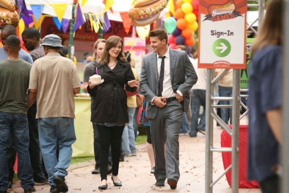 BONES:  Brennan (Emily Deschanel, L) and Booth (David Boreanaz, R) attend the Gluttony Games, an eating contest, in &quot;The Hot Dog in the Competition&quot; episode of BONES airing Thursday, Nov. 10 (9:00-10:00 PM ET/PT) on FOX.  &#xa9;2011 Fox Broadcasting Co.  Cr:  Patrick McElhenney/FOX